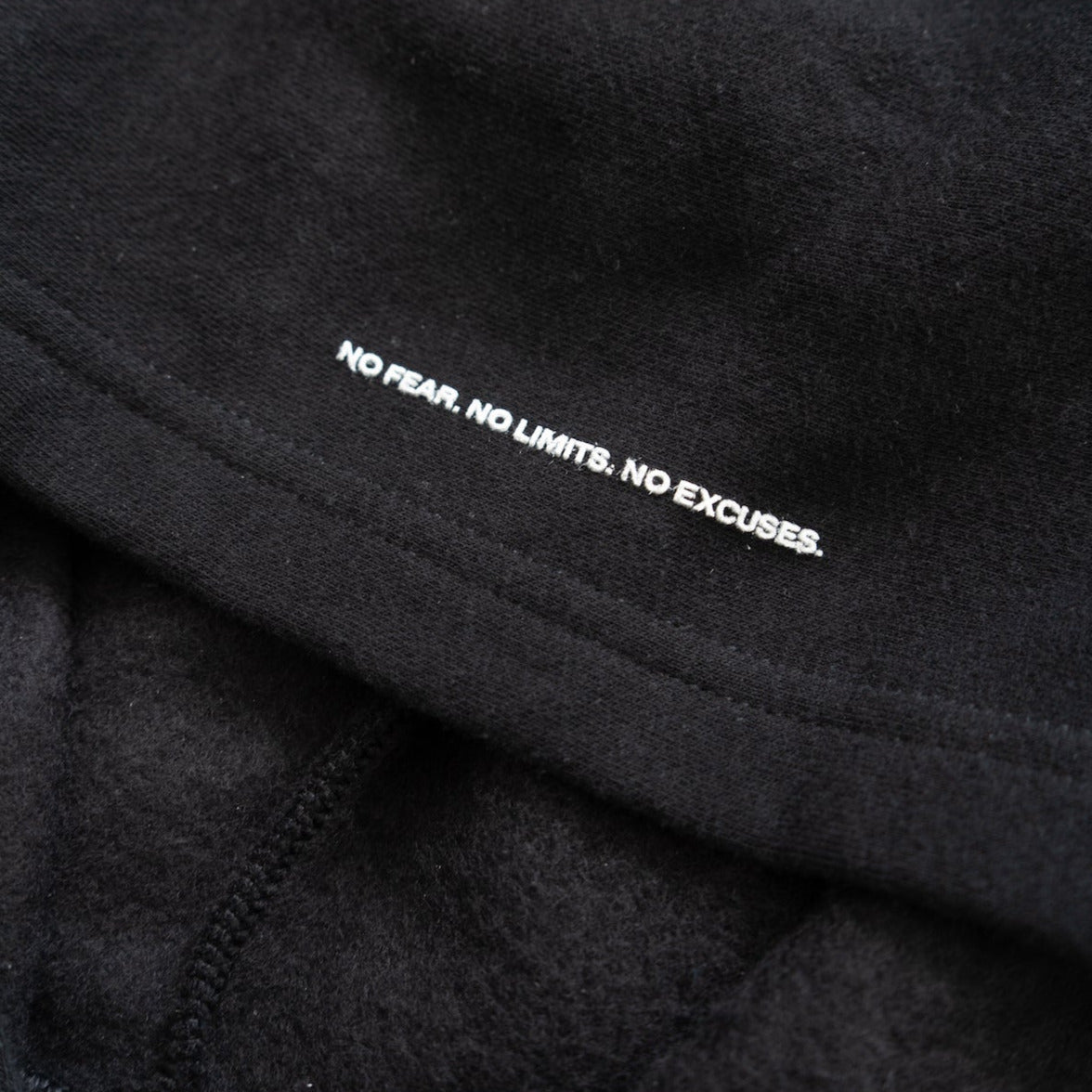 PUFF PRINT WISDOM HOODIE IN BLACK